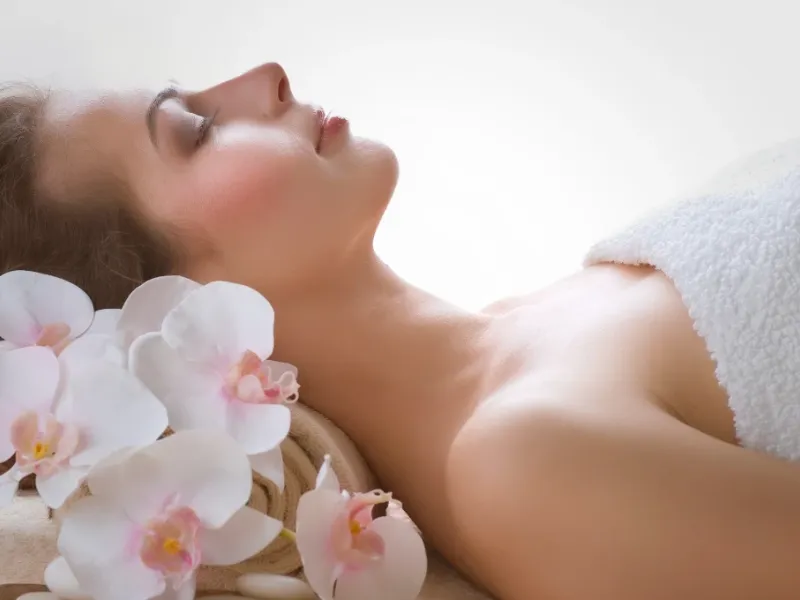 Woman in spa for esthetician services.